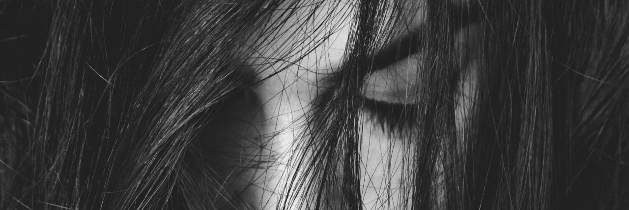 Grieving the Life I Had Before My Ehlers-Danlos Syndrome Diagnosis black and white photo of a woman with long dark hair