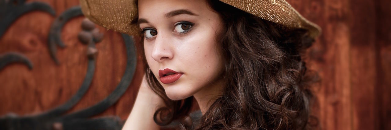 What It's Like to Be Depressed and 'High-Functioning' at the Same Time girl with hat