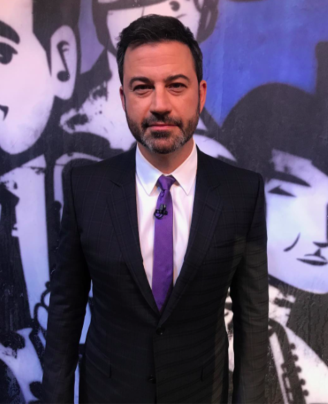 Jimmy Kimmel in a suit with purple tie