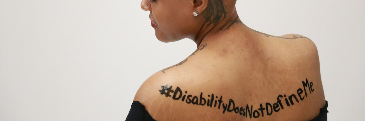 5 Ways to Stay Motivated From a Business Owner With Muscular Dystrophy The back of a woman with a tattoo.