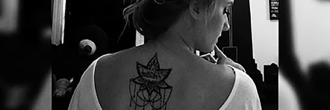 Alex's lotus tattoo.