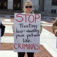 dont punish pain rally, sign says stop treating law abiding pain patients like criminals
