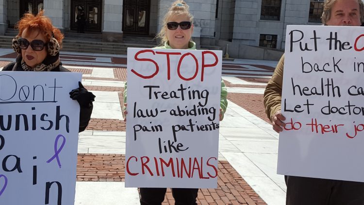 dont punish pain rally, sign says stop treating law abiding pain patients like criminals