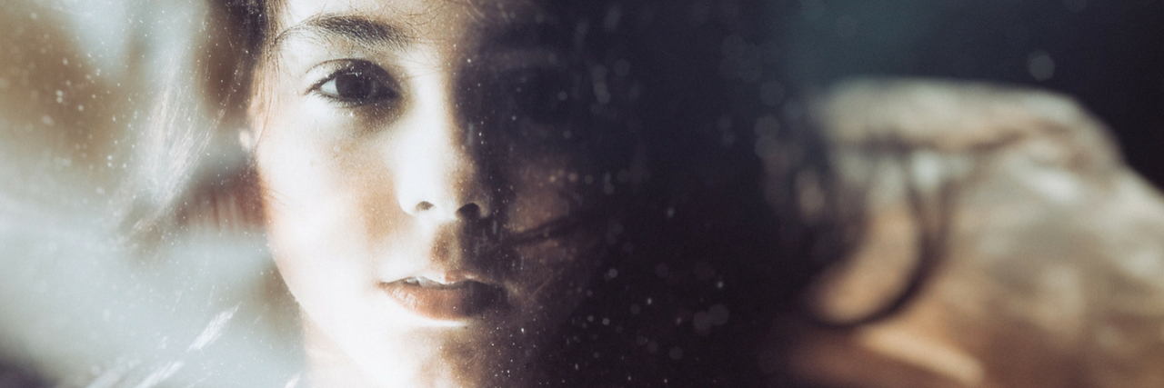 Things People Assume About You When You Live With Depression A woman who appears to be under water. Text reads: 24 Things People Assume About You When You Live With Depression