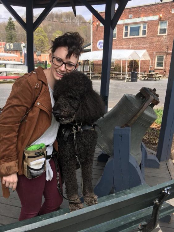 woman hugging her dog