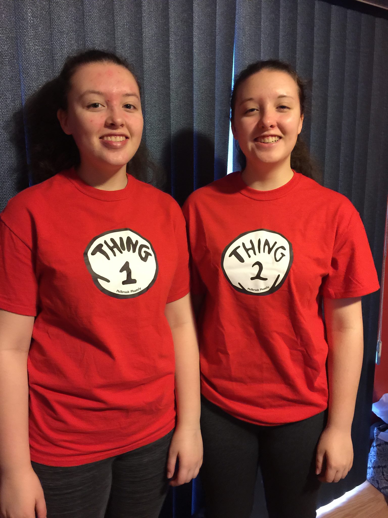 A picture of twins wearing "Thing 1" and "Thing 2" shirts.