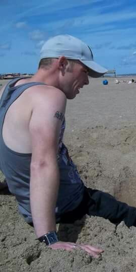 man sitting on beach