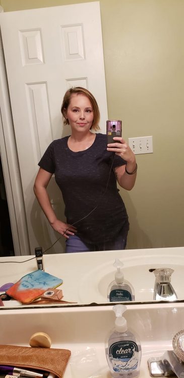woman's selfie in bathroom mirror