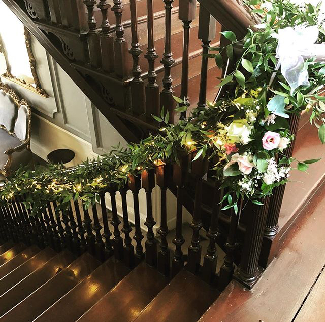 A picture of beautifully decorated stairs in the building. 