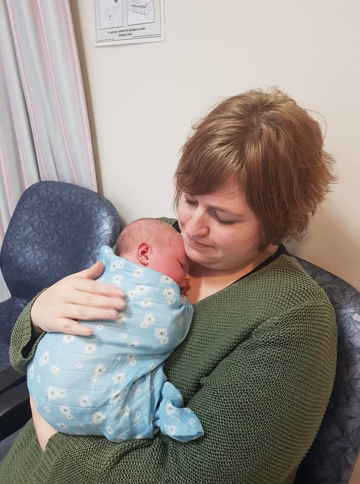 woman holding newborn baby