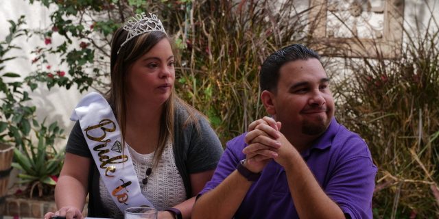 'Born This Way' Season 4, Episode 1 Recap: 'Pursuit of Happiness' Cristina wearing a tiara and a sash that says, "bride to be" sitting by Angel.