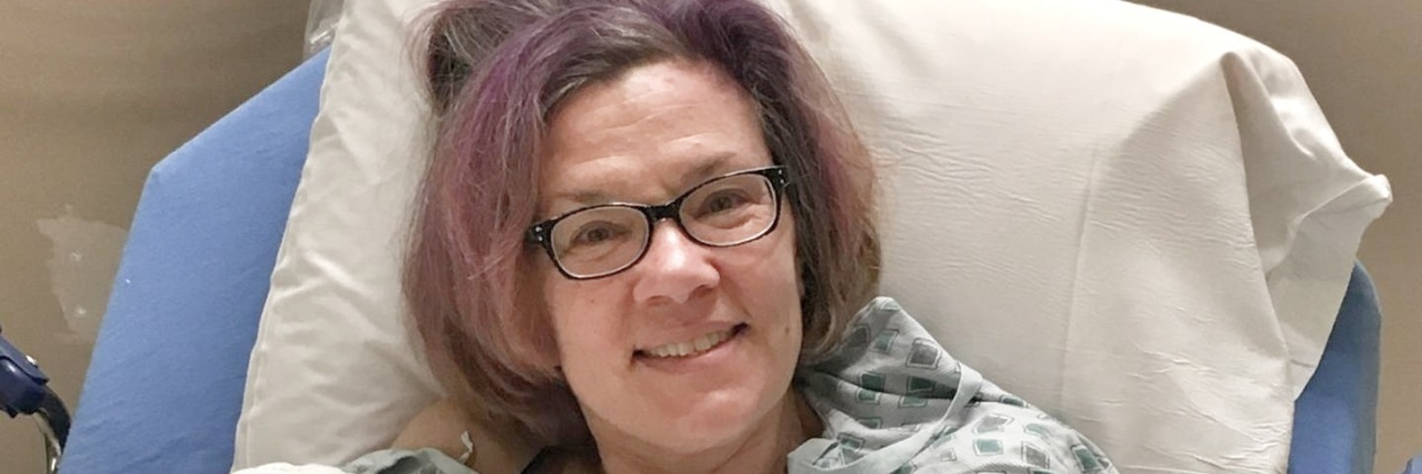 My New Perspective That Makes Colonoscopies Less of a Pain in the Ass A picture of the writer in a hospital bed, giving a thumbs up.