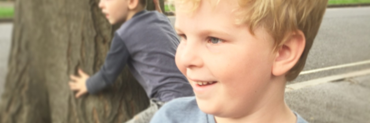 Please Stop Commenting on My Son’s Weight Little boy looking to the side and smiling