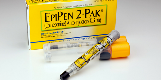 EpiPen box with an EpiPen in front of it.
