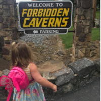 Forbidden Caverns entrance with Stella's back to the camera and inside the caverns
