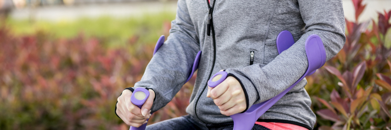 It's OK If Your Feelings About Your Disability or Illness Fluctuate A picture of a woman's hands on crutches.