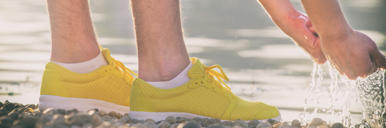 How My Adult Autism Diagnosis Led to Self-Acceptance Cooling down after jogging beside the water.