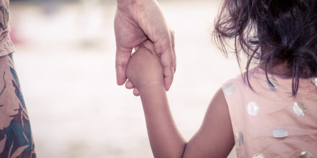 5 Lessons I Wish I Had Known After My Child's Life-Changing Diagnosis child holding mother's hand