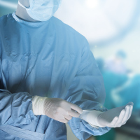 Medical team preparing equipment for surgery in operation room