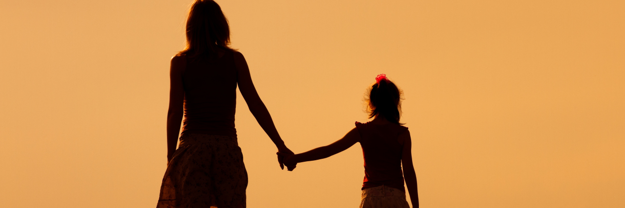 Hearing 'Your Child's Life Is Going to Be Difficult' Mother and daughter enjoy watching sunset together.