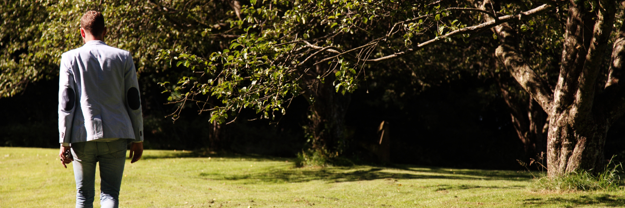 Making My Own Choices as an Adult With Autism Man walking outdoors in the sunlight.