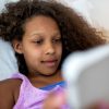 African American girl using tablet.
