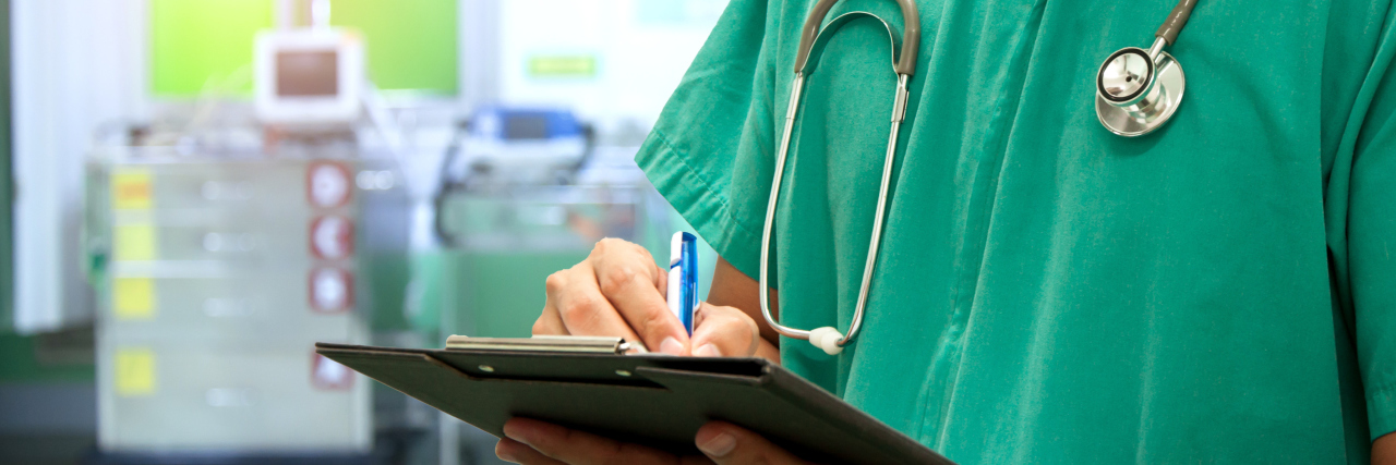 Letter to the ER Nurse Who Asked About My Gender nurse writing a medical prescription in hospital