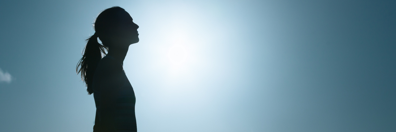 Hypothyroidism: Accepting I'll Never Be as Healthy as I Once Was Young woman looking up into the sky.