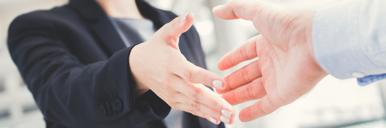 Answering 'How Are You?' If You Have Parkinson's Disease Businesswoman going to shake hands with businessman.