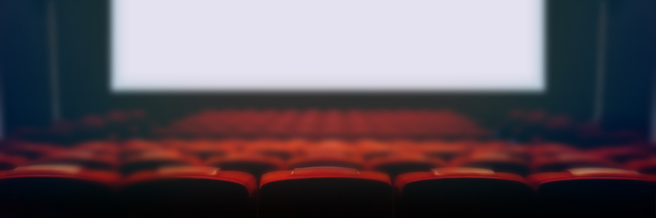 Why CRPS Prevents Me From Going to Movies Empty movie cinema seats with blank wide white screen