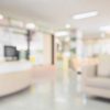 A blurred image of a hospital waiting area.