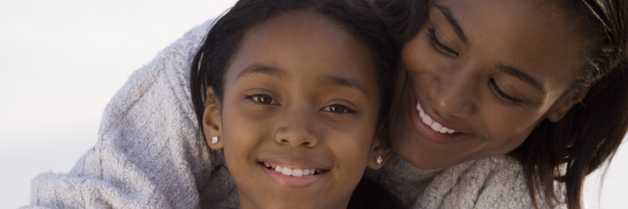 Why I Talk About My Illness and Other Hard Topics With My Daughter A mom hugging her young daughter.