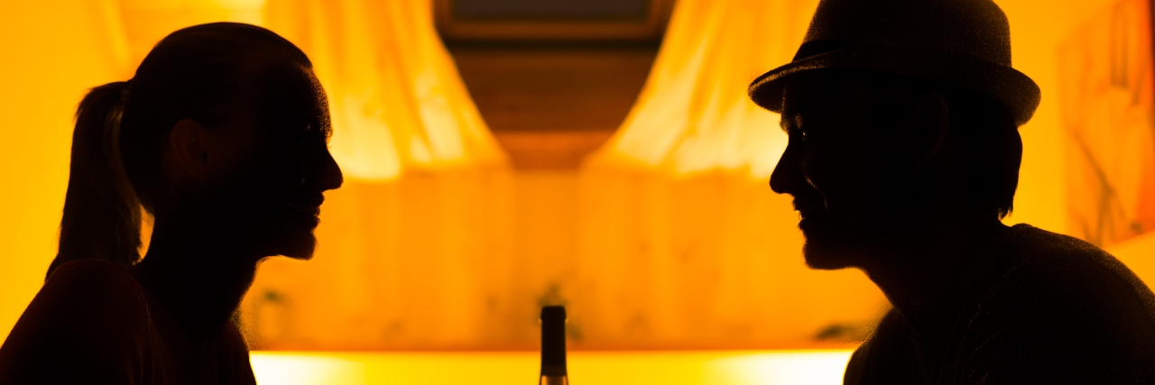 Being a Hopeless Romantic With a Disability Couple drinking wine on a date.