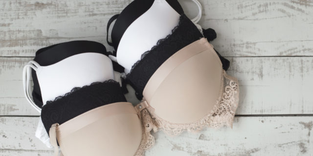 Bra Shopping Is Hard With Poland Syndrome, But It's Taught Me So Much Four different colored bras folded on a table