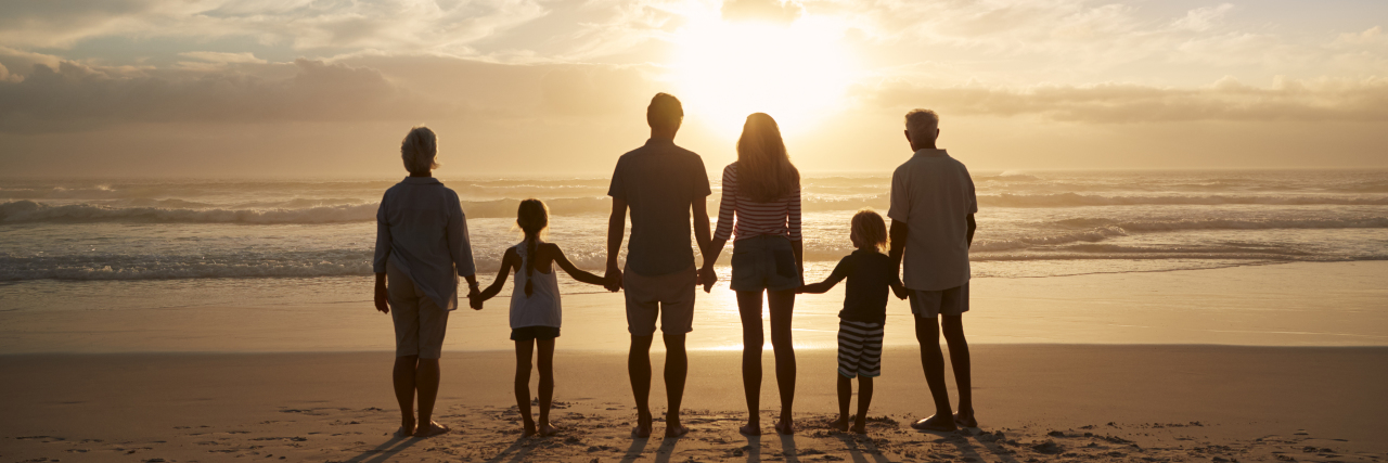 silhouette of a family on a beach