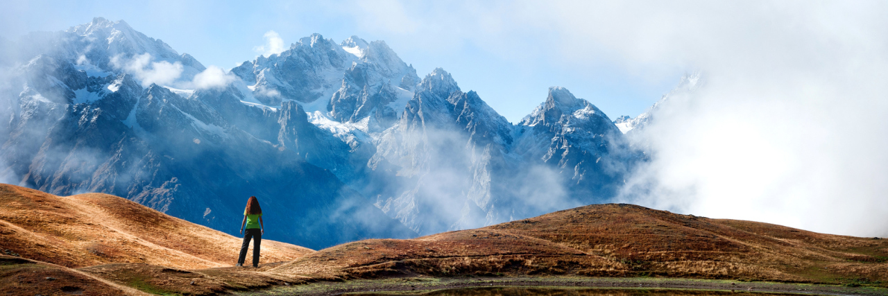 Finding Peace in Moments When You Feel Sick and Helpless mountains reflected in a clear lake
