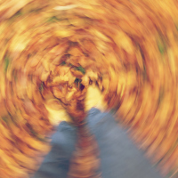 A blurred image of a woman's feet.