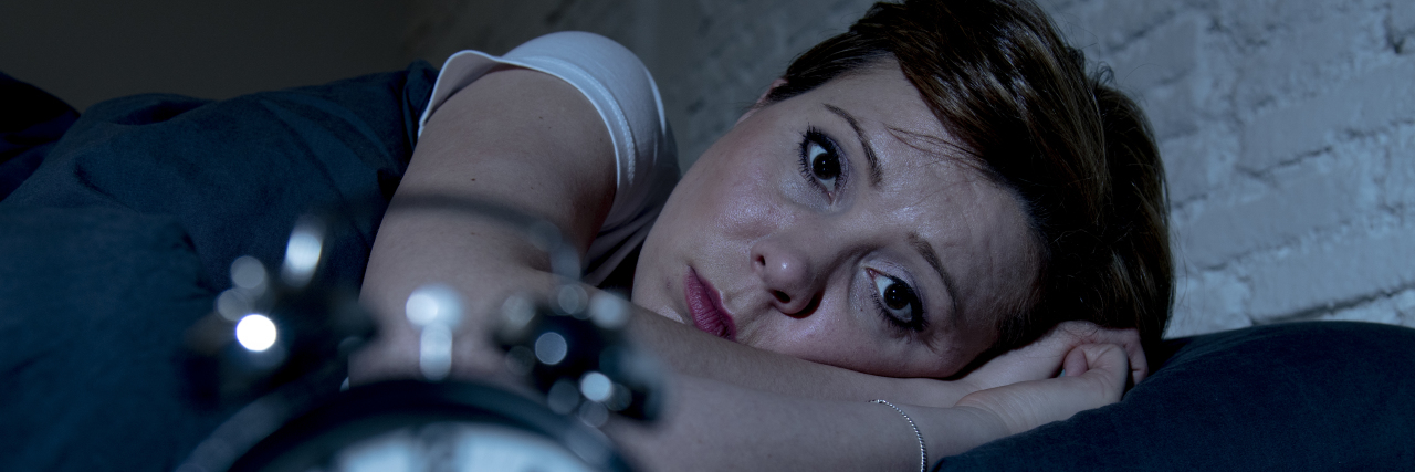 'I Don't Want to Discuss It': When Therapy Makes You Uncomfortable Young red haired caucasian woman lying in bed late at night trying to sleep suffering from insomnia, nightmares or sleeping disorders. looking stressed and exhausted.