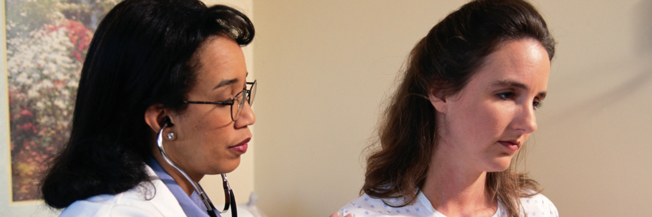 A doctor treating a patient.