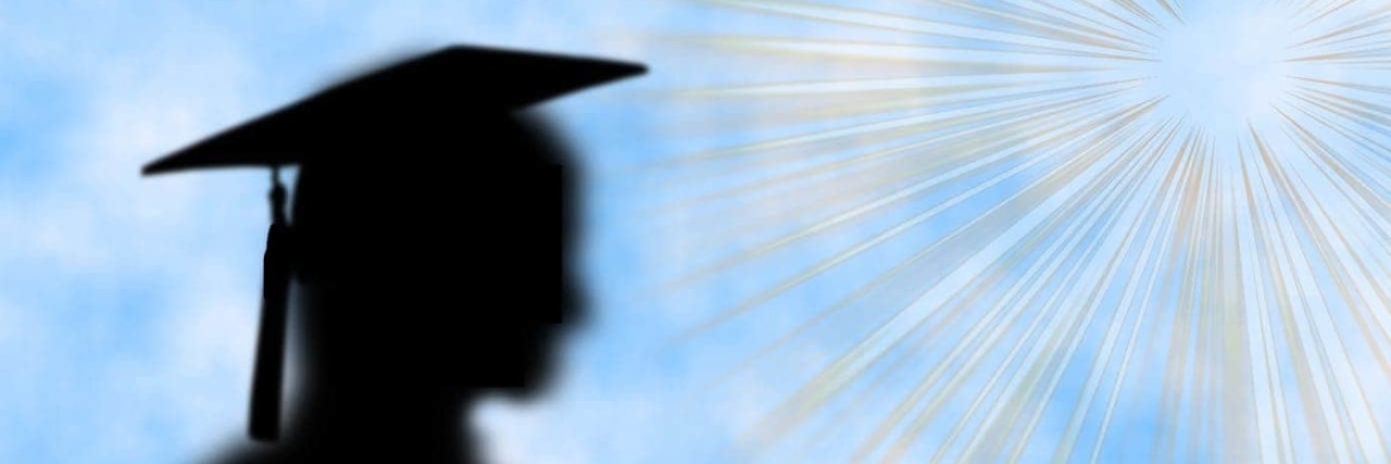 Silhouette of woman in graduation cap.