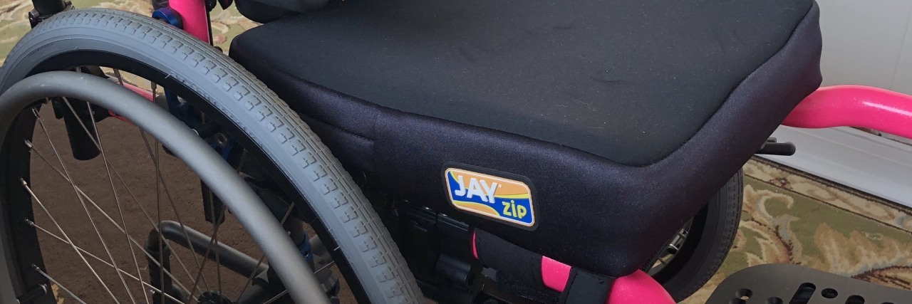 What It's Like To Be a Kid in 'Wheel Life' A pink and black wheelchair