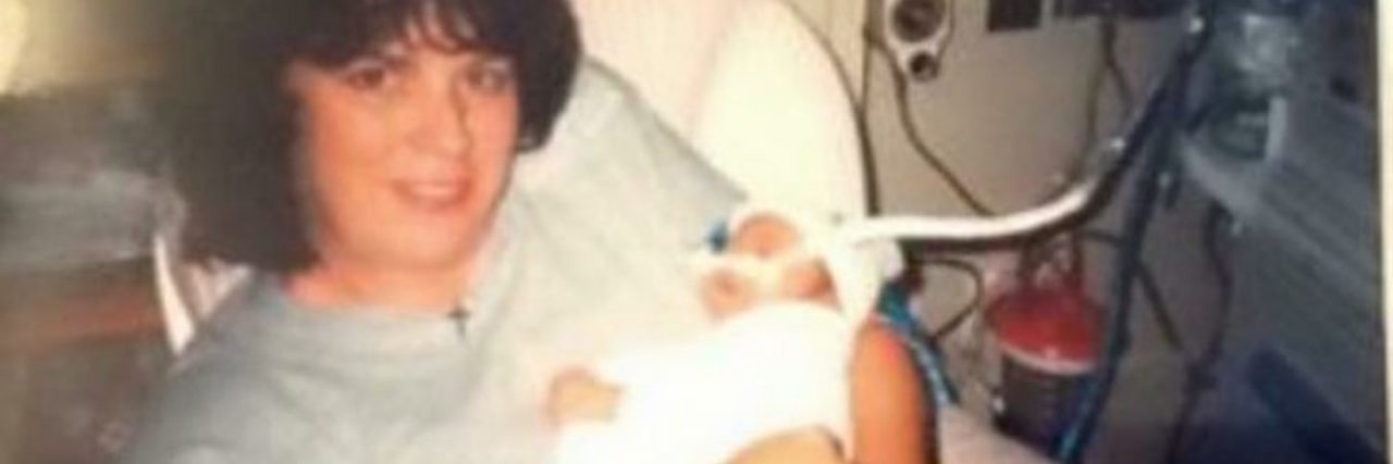 Letter to Heart Mom From Daughter author's mom holding her as a baby in the hospital