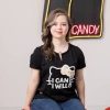 Megan Bomgaars wearing shirt that reads "I can and I will" and a figuring of Hello Kitty next to her