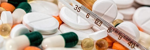 medication tablets and a syringe
