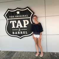 Sarah standing outside the Tap & Barrel.