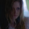 Amy Adams in Sharp Objects. Her character, Camille, is wearing a white night gown and looks sweaty and sick