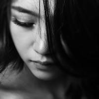 black and white close up photo of a woman's face