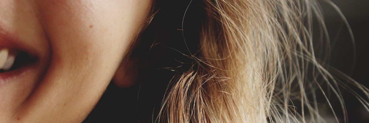 What Happiness Feels Like in a Borderline Brain close up of blonde woman smiling into camera