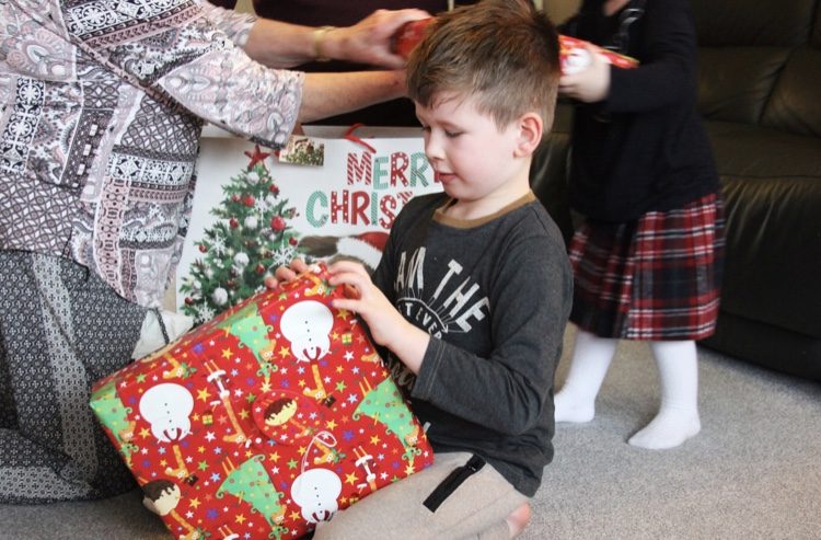 Brody opening up christmas presents