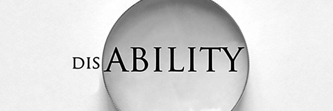 Magnifying glass enhancing the "ability" in disability.